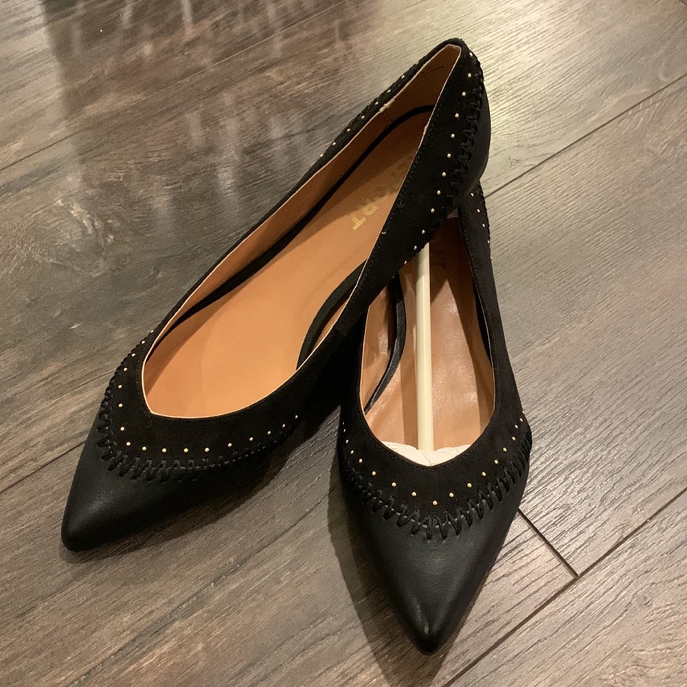 Black leather and suede flats.